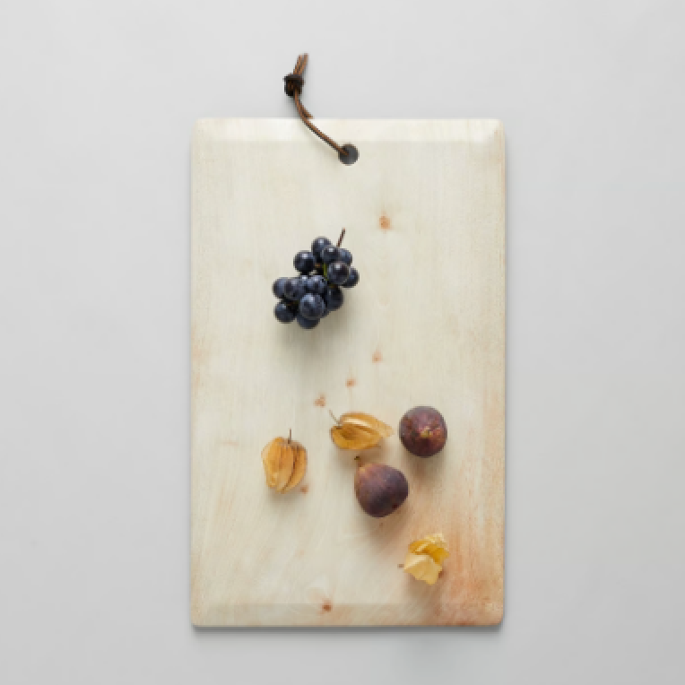 Handmade wood serving board with natural live-edge grain